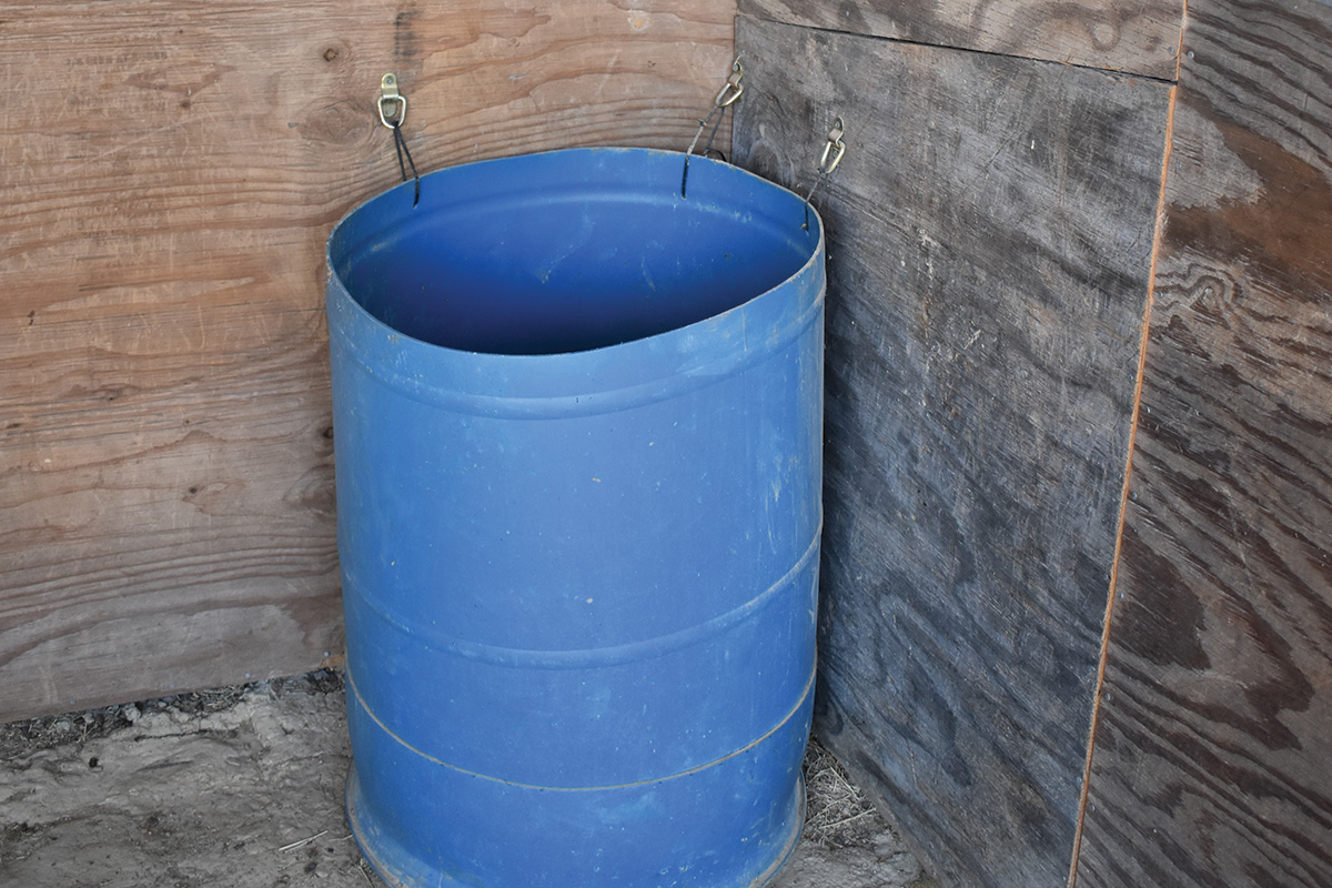 A plastic barrel as a corner feeder